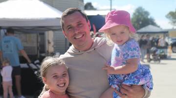 Isla, Dan and India Weller at the Bathurst Farmers' Market in March. Picture by Phil Blatch