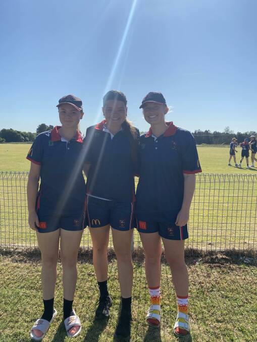 Eloise Fairley, Ellen Dolbel and Montana Griffith in their Western uniform in Raymond Terrace ahead of the under 19s country championships. Picture supplied