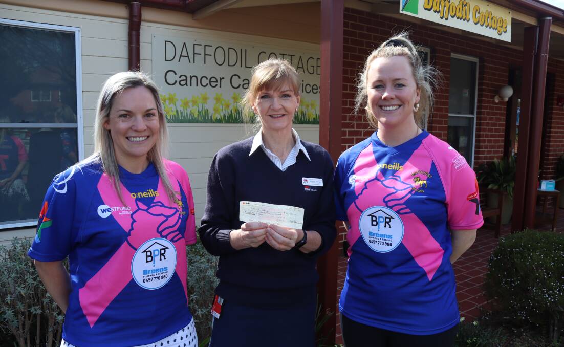 Ali Stanford and Kate Gullifer handing over a donation to Daffodil Cottage's Mooreen Macleay (middle). Picture by Amy Rees