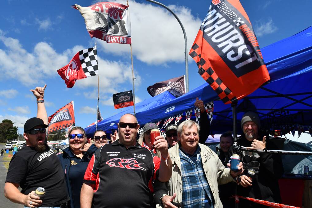 Anthony Scott [middle] with friends and family from Newcastle getting into the 2023 Bathurst 1000 60th anniversary spirit on Thursday, October 5. Picture by Amy Rees