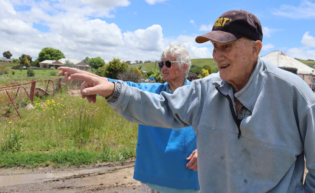 Dorothy and Colin Glazebrook pointing to where the water levels rose to on their property at The Lagoon. Picture by Amy Rees
