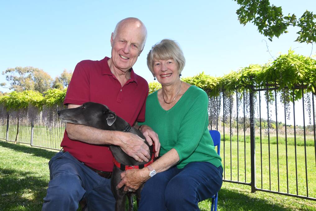 Neil Jones and Libby Jones with greyhound Rosie in Orange. Picture by Carla Freedman 