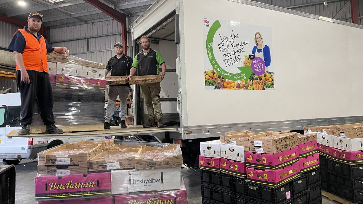 James Reid, Wayne Nielan and Elliot Redwin busily preparing for a weekend of Easter deliveries to the Central West. Picture by Alise McIntosh