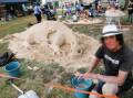Den 'The Sandman" Massoud creating a sand sculpture at the Bathurst Heritage Trades Trail. Picture by Phil Blatch
