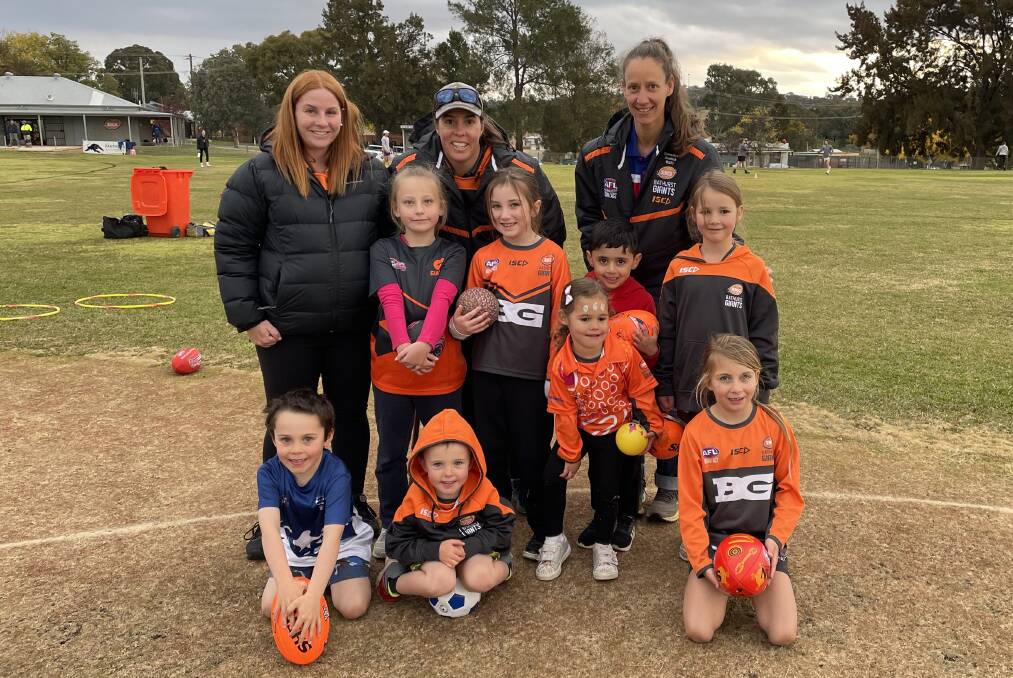 Organiser of the Auskick Indigenous Games Hailee Taylor with Auskick kids and coordinators. Picture by Alise McIntosh
