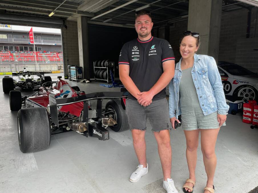 Caspar Howard and Paris Dorrell admiring the quality of the cars in the pits of the Bathurst International. Picture by Alise McIntosh