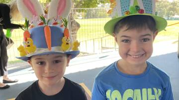 Jaxon Phillips and Chase Parkes proud as punch of their fancy hats for the Easter hat parade at Bathurst Public. Picture by Bradley Jurd