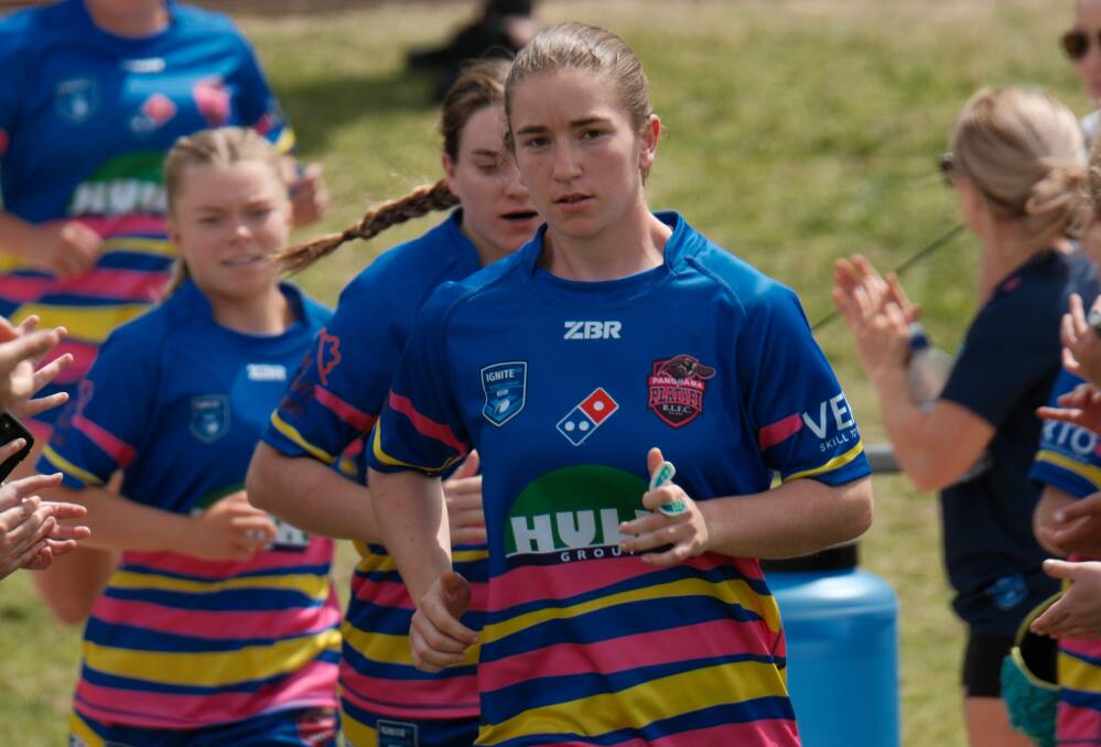 Sarah Colman runs onto the field for Sunday's match at Jack Arrow Oval. She scored a try and booted six goals in an 18-point win for the Panorama Platypi. Picture by James Arrow