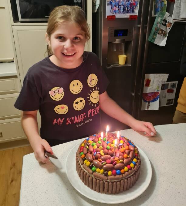 Olivia Chapman celebrates her birthday with a cake. Picture contributed