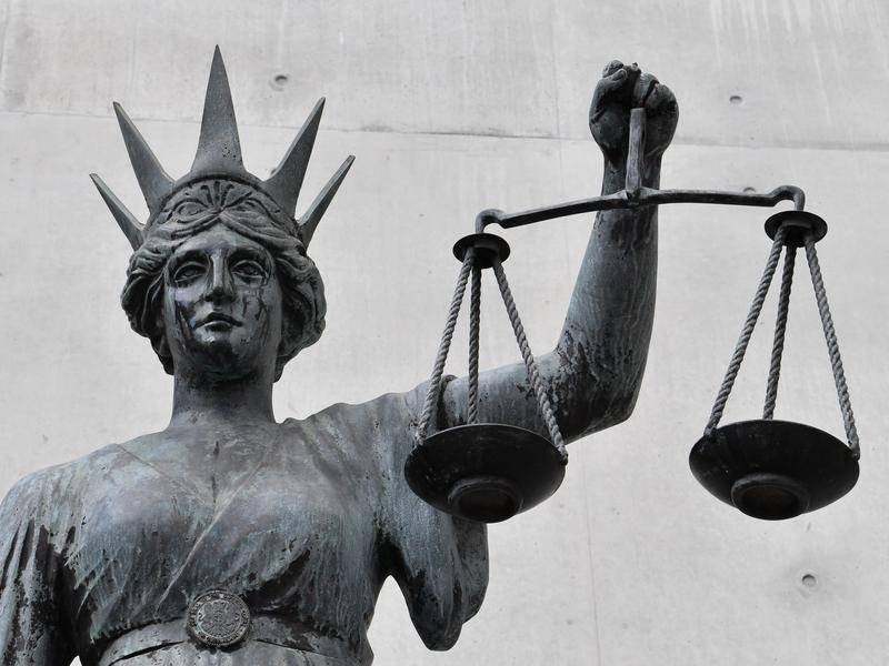 Lady Justice statue placed outside of a court holding scales. File picture
