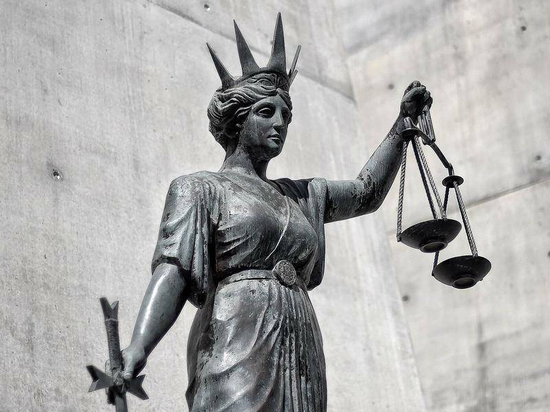 A statue of Lady Justice holding her scales and a sword. File picture