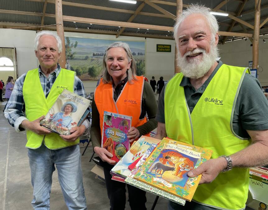 Lifeline Central West volunteers John Sjollema, Carol Patterson and John Maclean at the Bathurst book fair on November 6. Picture by Jay-Anna Mobbs