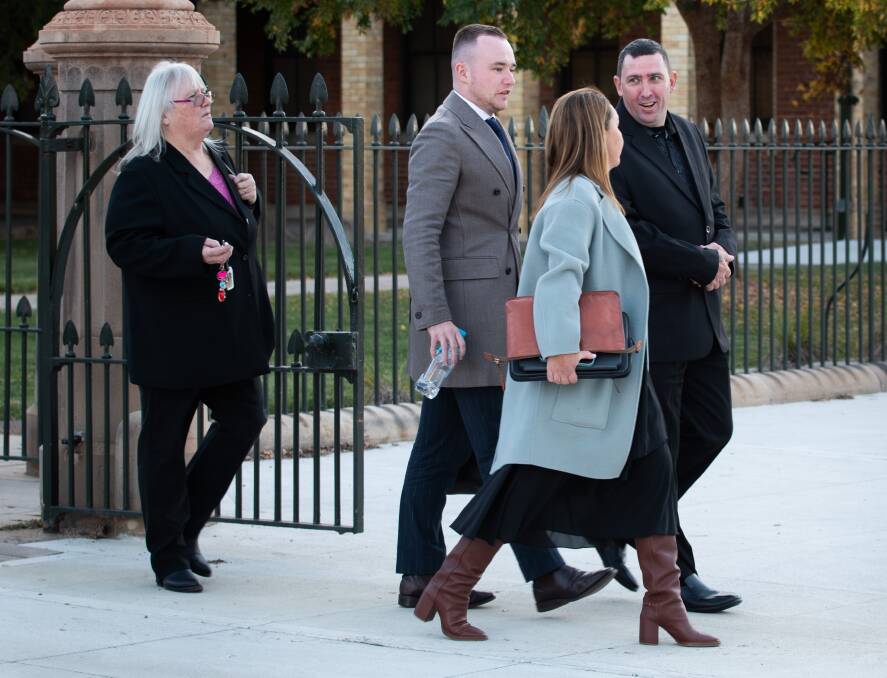 Stephen Shane Greenfield (black suit, right) leaving Bathurst Courthouse with part of his legal team on May 22, 2024. Picture by James Arrow