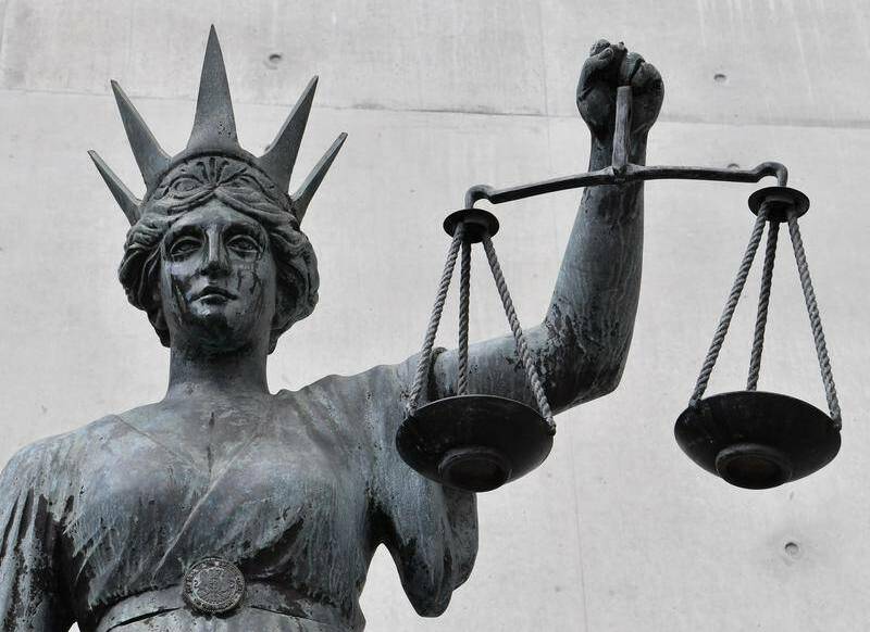 A statue of Lady Justice holding a set of scales. File picture