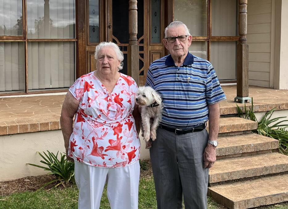 Lorna and Colin Shapland with their dog Fluffy outside of their temporary Mudgee rental. Picture by Benjamin Palmer