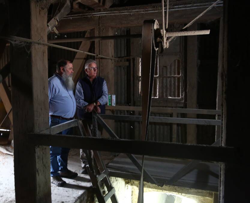 Charles Sturt University then-Professor of Engineering Jim Morgan and then-Tremain's Mill owner Stephen Birrell in the wooden silos back in 2017.
