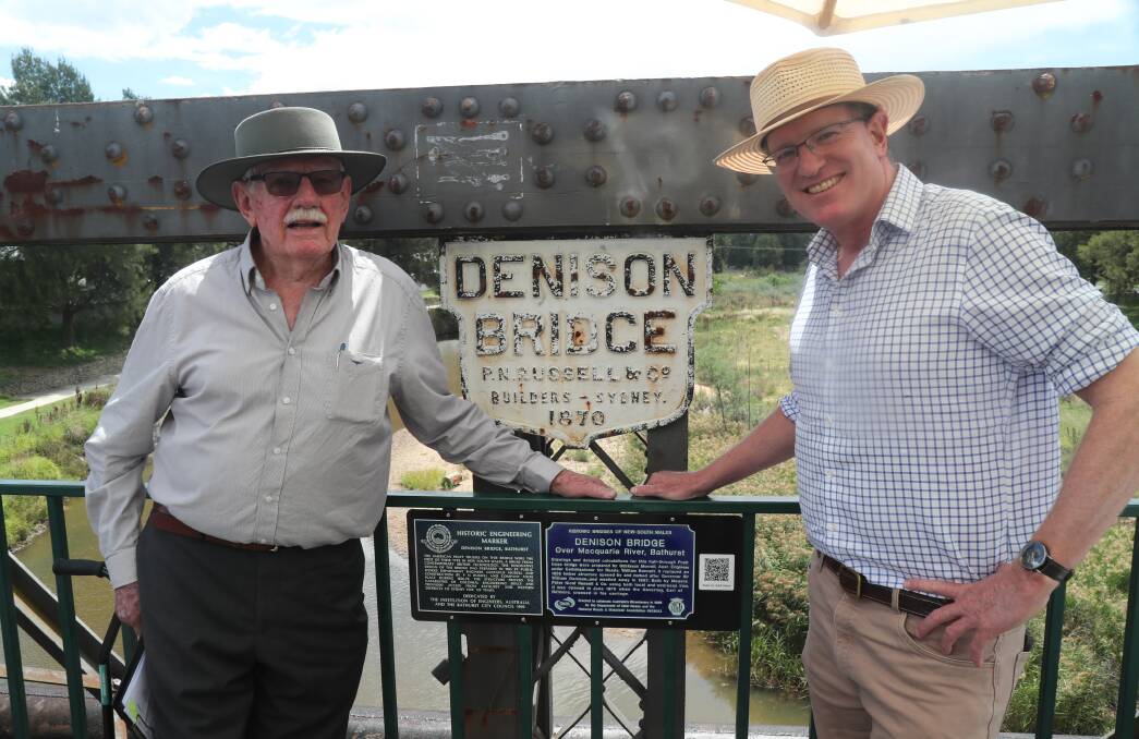 Graham Priddle and federal Member for Calare Andrew Gee with the newly installed plaques on the Denison Bridge. Picture by Phil Blatch.