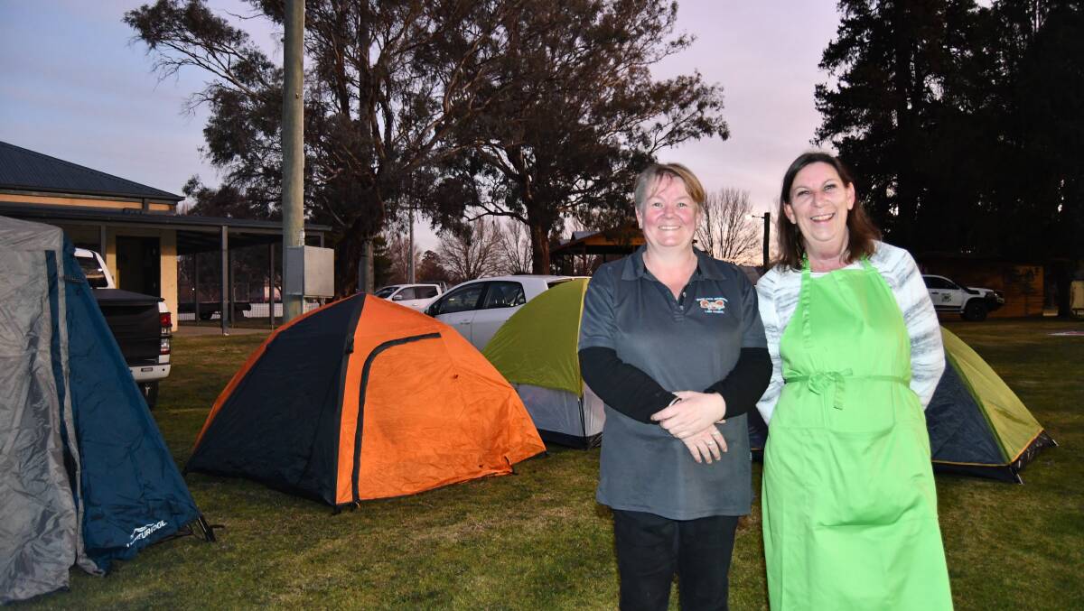 Wattle Tree House's Raylee Patterson and Terry Tupper surrounded by tents at a sleepout event held in August to raise awareness about homelessness. Picture by Rachel Chamberlain