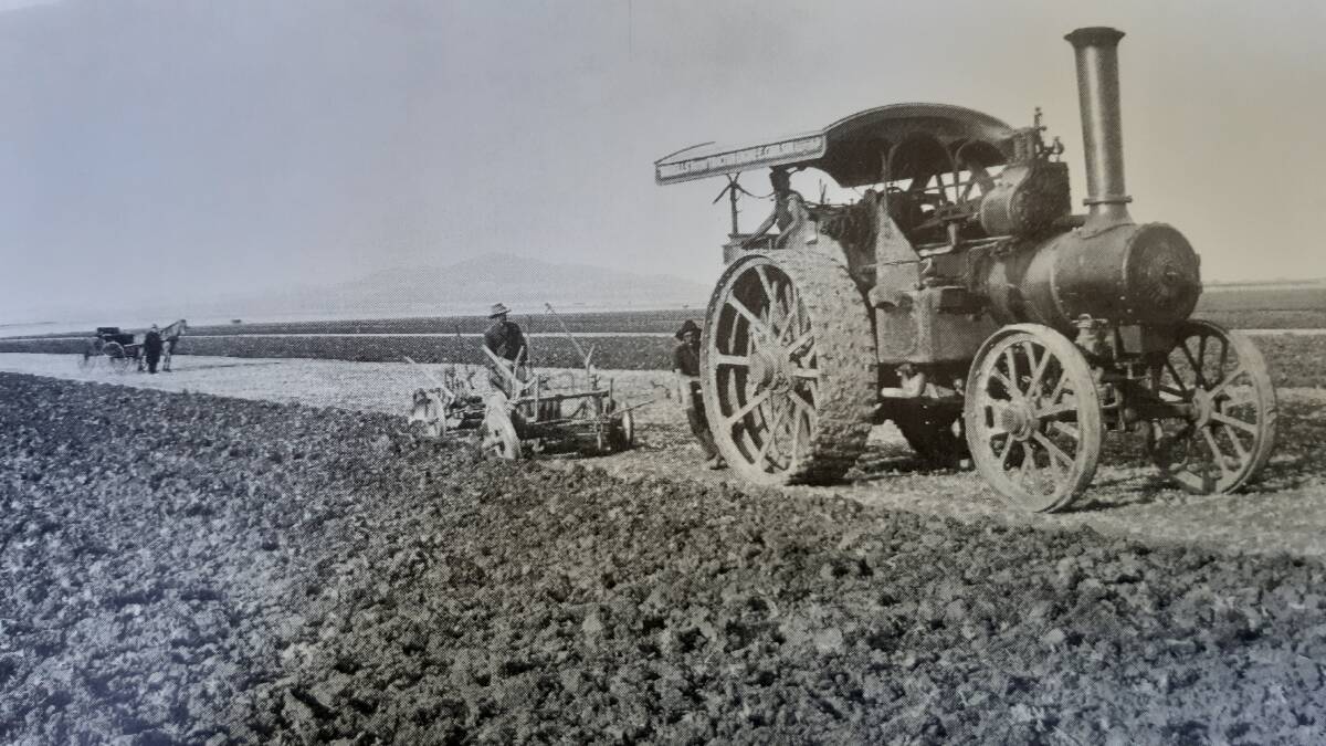 A steam-driven tractor pulling a disc plough on a Mallee farm about 100 years ago.