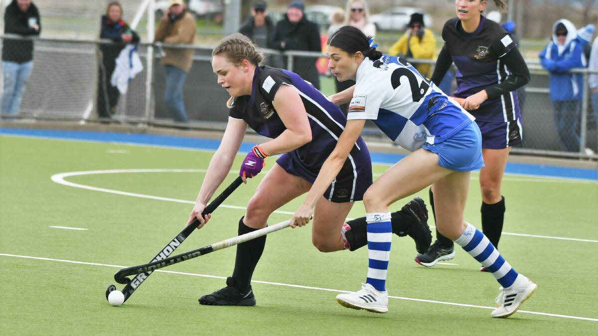 Lithgow's Mackenzie Stewart and St Pat's Millie Fulton battle for the ball in Saturday's women's Central West Premier League Hockey grand final. Picture by Chris Seabrook