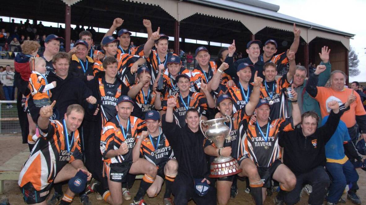 Lithgow Wolves celebrate after defeating Panthers on grand final day in 2005.