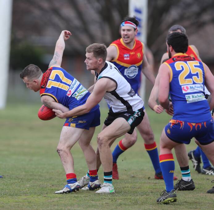 Bushranger forward Nathan Smith tackles Demons rival Joe Hedger at George Park last season. This year the Bushies will travel to Dubbo three times. Picture by Phil Blatch