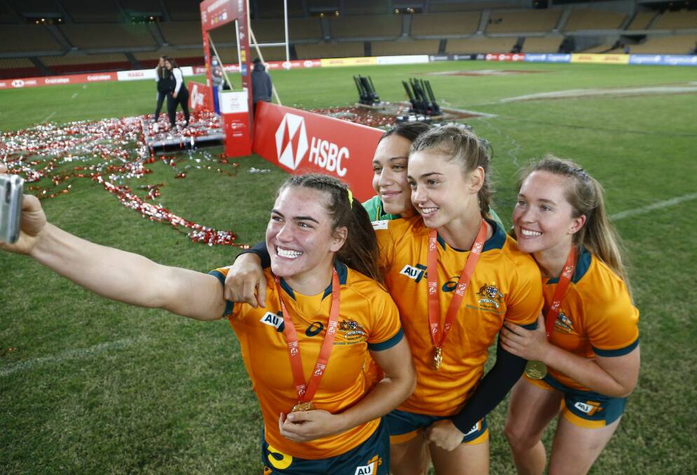 WINNERS ARE GRINNERS: Jakyia Whitfeld and her team-mates pose for a selfie after their gold medal win in Seville. Photo: MARTIN SERAS LIMA