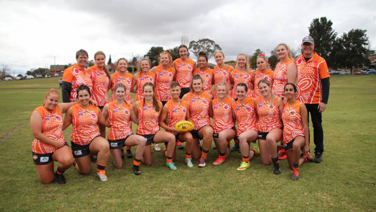 Liz Kennedy, pictured with her 2022 Giants, enjoyed three premierships in her five seasons of coaching.