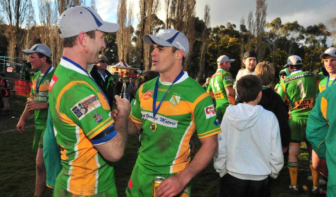 Warick Colley and Mick Sullivan after claiming the 2011 Group 10 grand final together at Endeavour Oval. Picture by Steve Gosch.