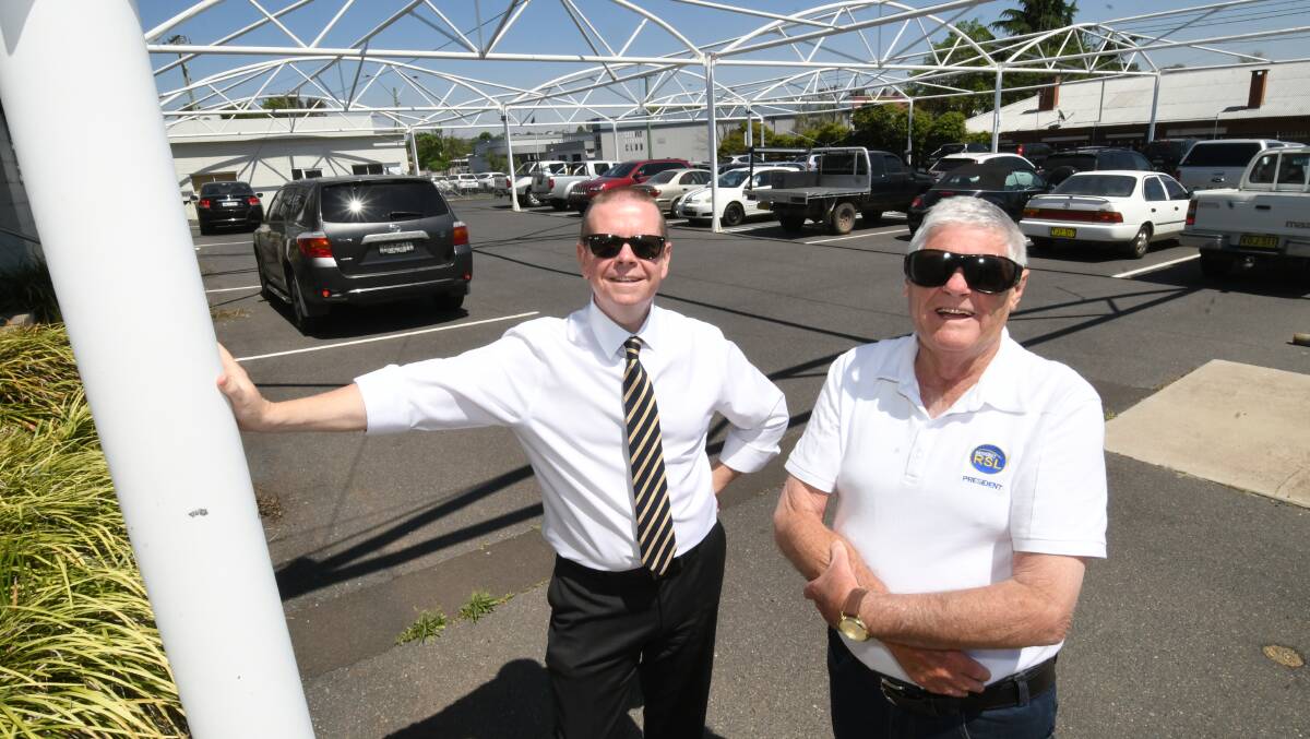 ACQUISITION: Bathurst RSL general manager Peter Sargent and president Ian Miller in the former Clancy's car yard site on Tuesday. Photo: CHRIS SEABROOK