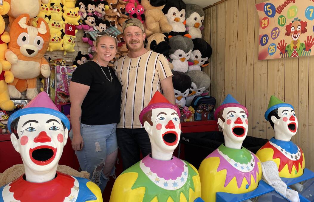 Tayla Fawkner and Scott St Clair, setting up the clowns in readiness for the Royal Bathurst Show.