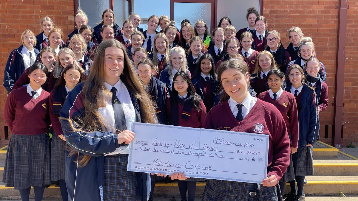 Bianca Cox with school captain, Annabel Burgess, and other Year 12 students.