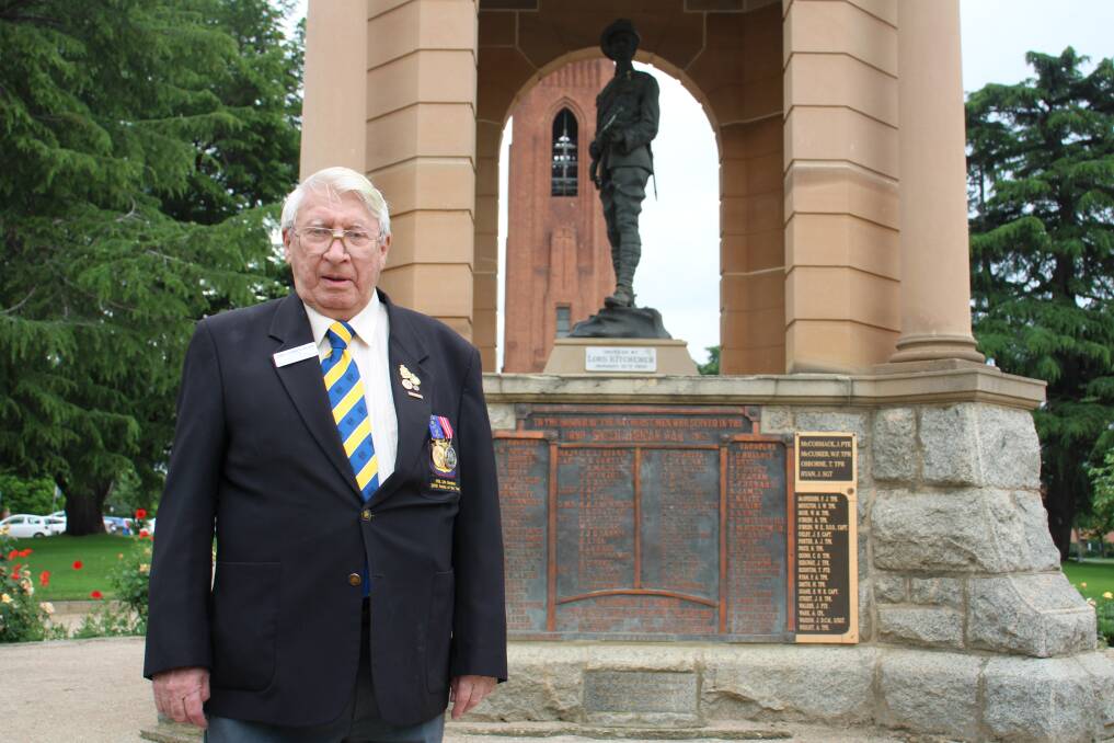 SERVICE MEDALS: War historian Denis Chamberlain, standing in front of the war memorial which Handcock, among others is named on.