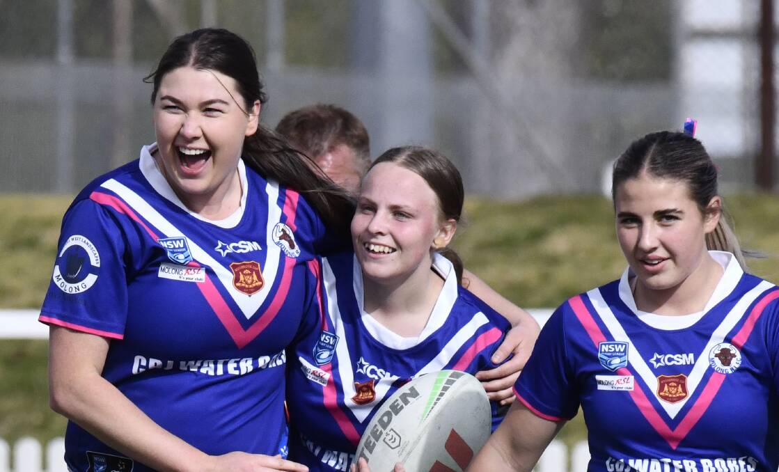 Molong Bulls captain Jesse Fulwood celebrates with try-scorer Libby Peschka during their 34-16 victory over the Grenfell Goannas. Picture by Jude Keogh