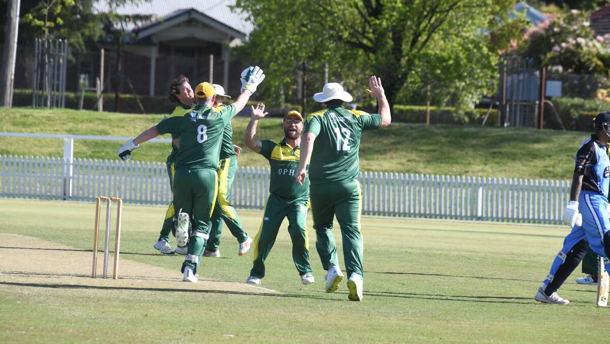 CYMS celebrating the wicket. Picture by Jude Keogh