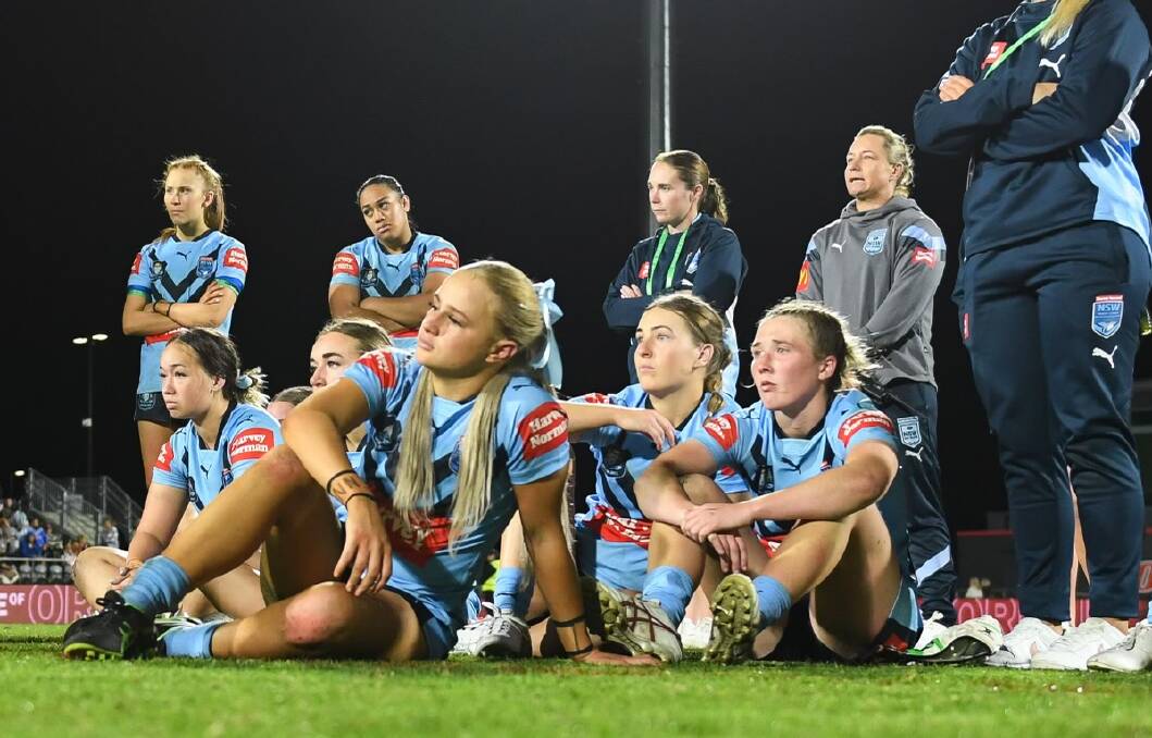 Kate Fallon (closest to camera) and her NSW teammates following their loss to Queensland. Picture by NRL Photos.