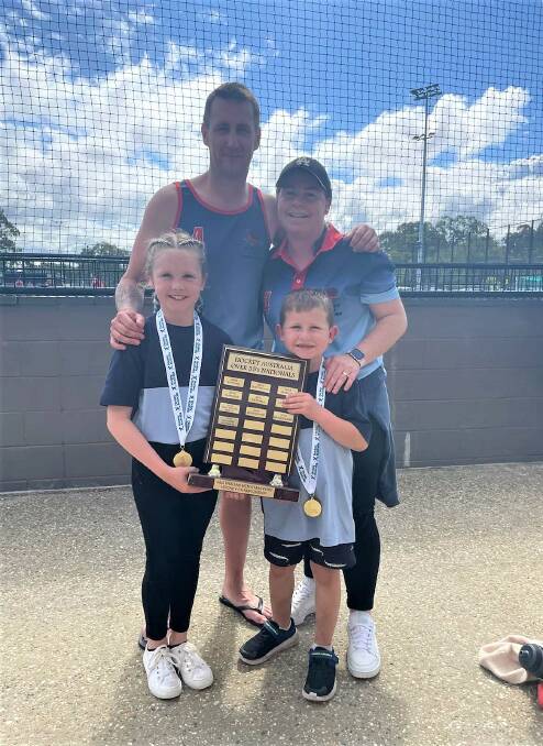 Jaden Ekert celebrates his Australian Hockey Masters victory along with his family.