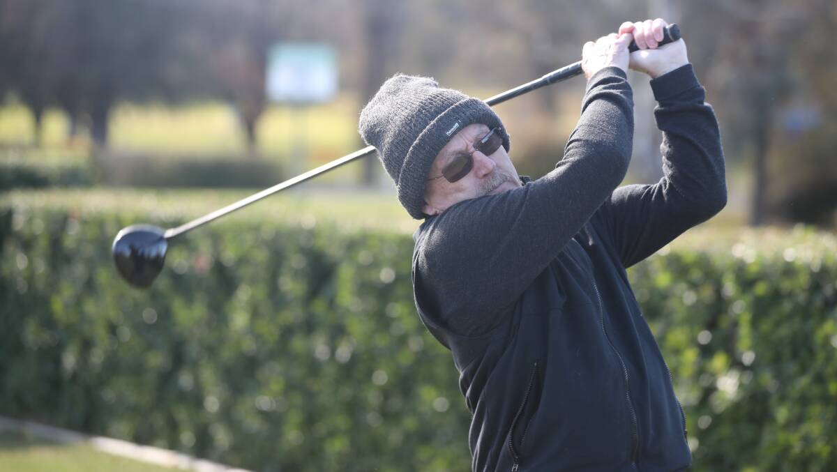 Russ McCarthy drives off the opening tee at the Bathurst Golf Club. Picture by Phil Blatch