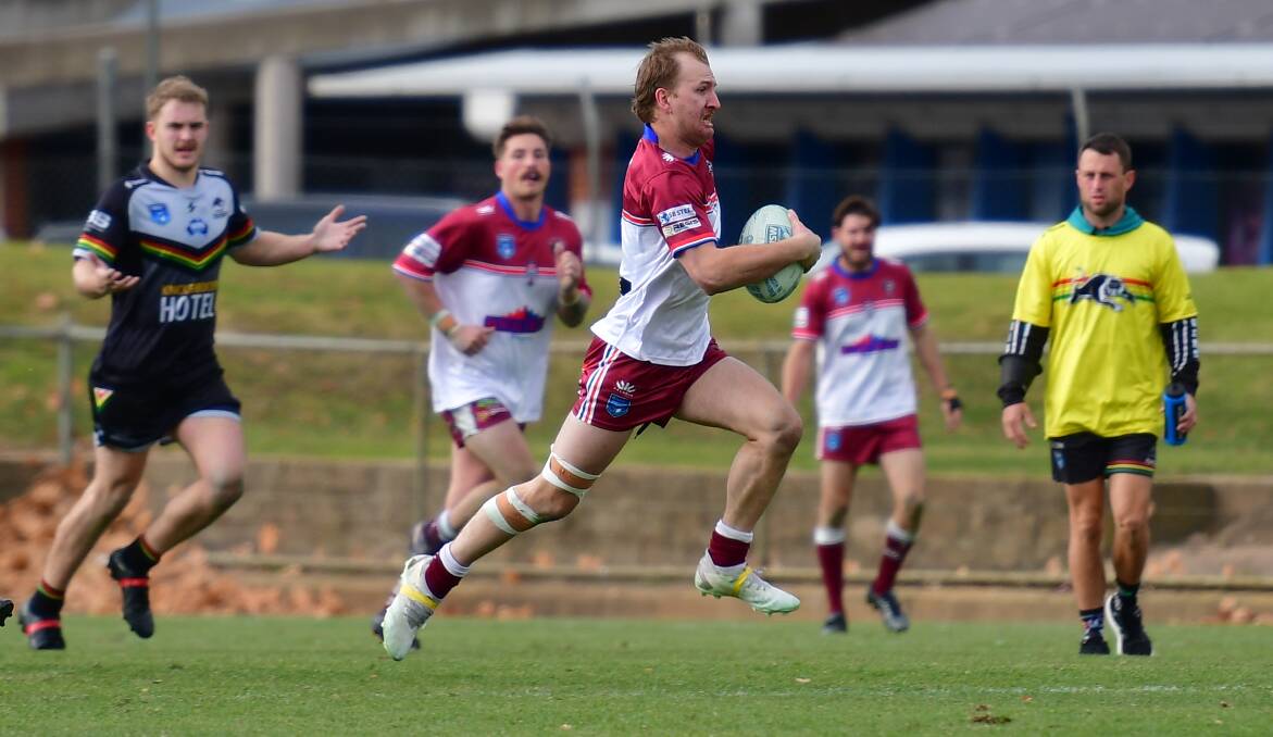 Blayney Bears fullback BIlly Cramp breaks through the Bathurst Panthers' defensive line to score the last try of the game. Picture by Alexander Grant.