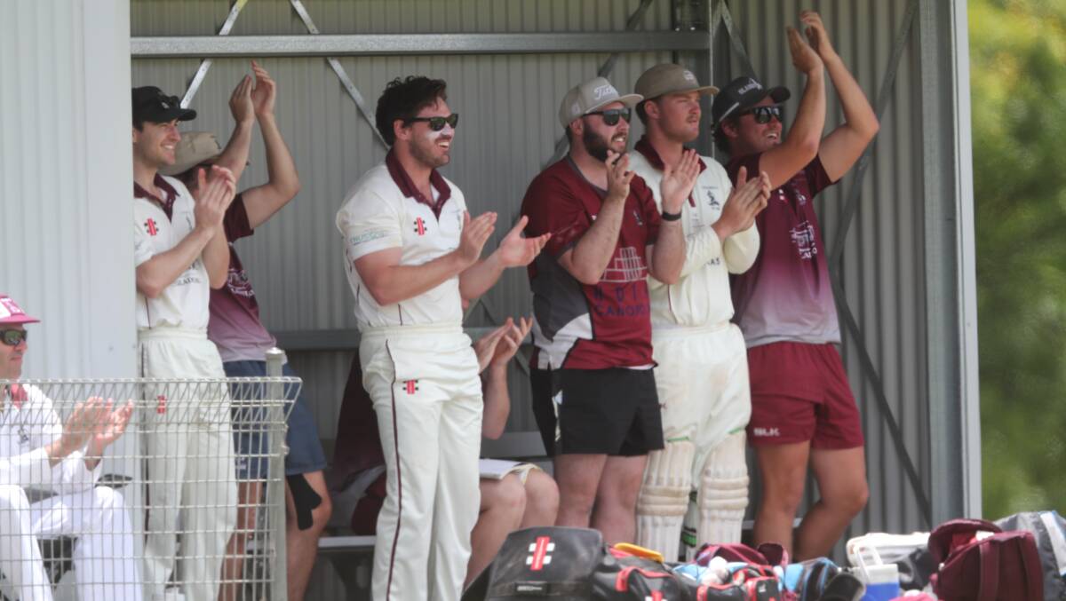 Cavaliers celebrate Cameron Laird's century. Picture by Phil Blatch.
