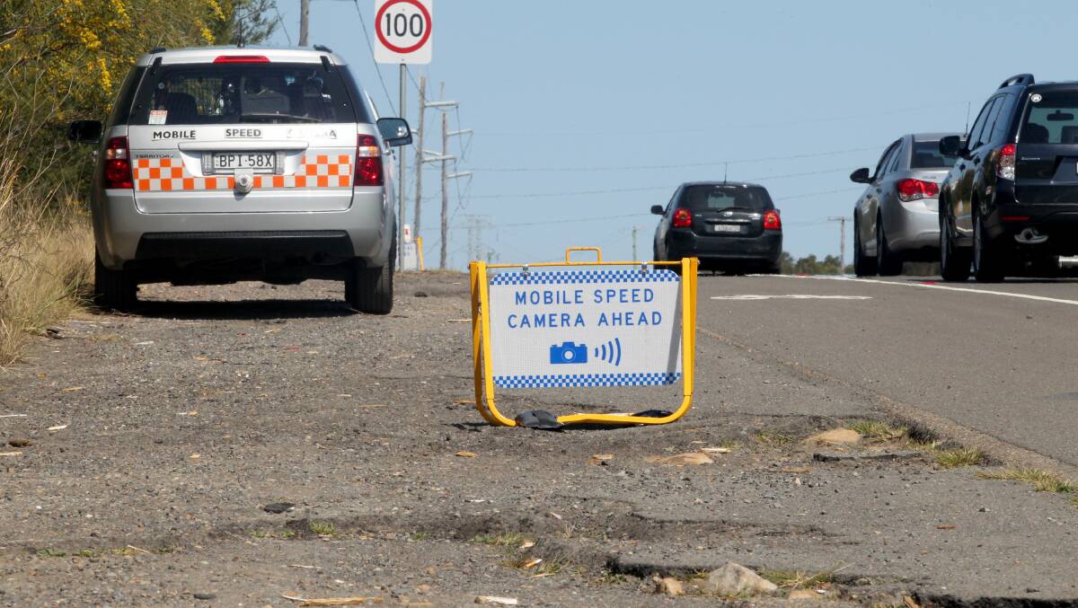 A signed mobile speed camera in operation on Princes Highway, Waterfall. Picture by Jane Dyson