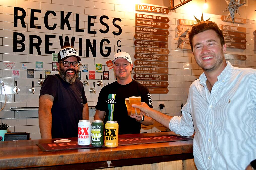 Reckless Brewing co-founder Jarrod Moore, driver Brad Schumacher, and deputy mayor Ben Fry. Picture by Rachel Chamberlain