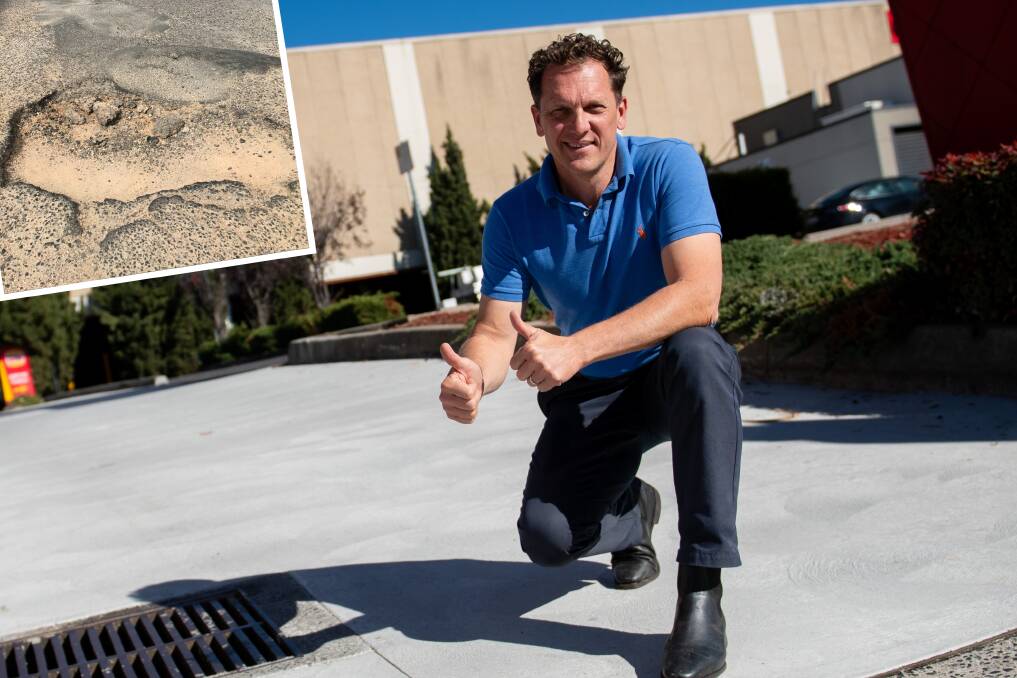 A previous big pothole (inset) and mayor Jess Jennings crouched on one of the driveways leading into the Bathurst Chase shopping centre. Main picture: James Arrow