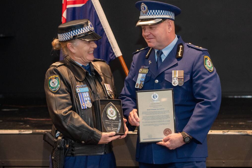 Senior Constable Lisa Anderson receiving the Paul Quinn Award from Superintendent Bob Noble. Picture by James Arrow
