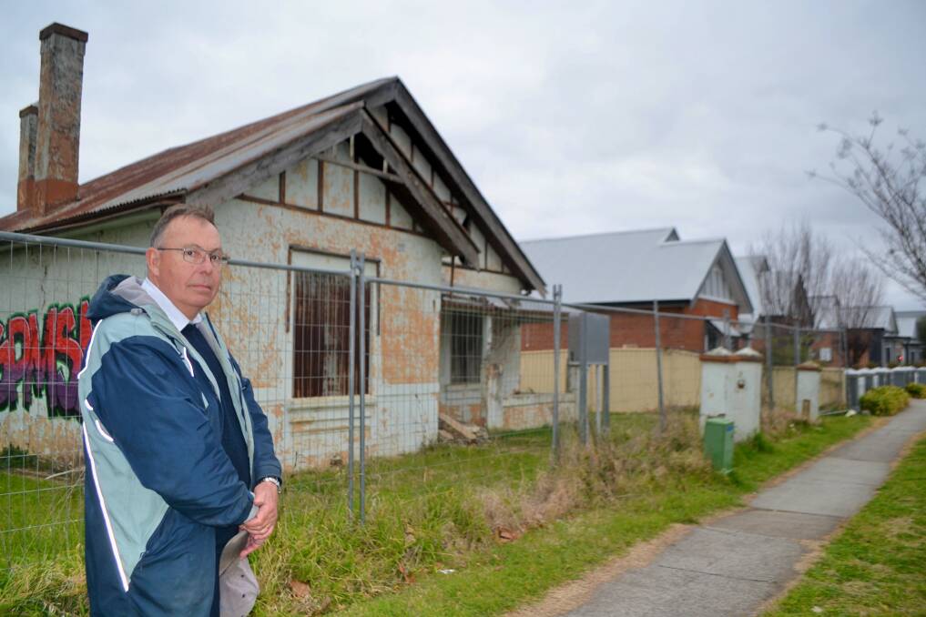 Chairman of the Bathurst Branch of the National Trust, Wayne Feebrey, outside of a cottage in William Street that will likely need to be demolished. Picture by Rachel Chamberlain