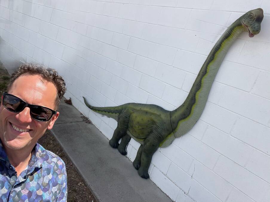 Mayor Jess Jennings finds one of the three dinosaurs hidden around Bathurst. Picture supplied