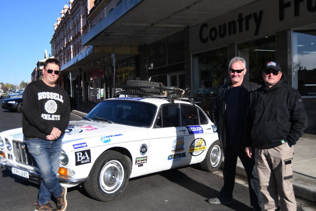 Paul Burge, Mark Bradbury and Scott Knight with the Jaguar they will drive in the Variety NSW Bash. Picture by Rachel Chamberlain