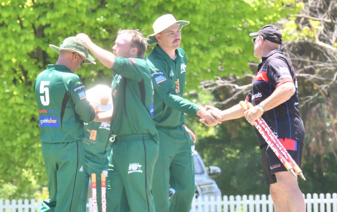 Ed Morrish shakes hands with Bathurst City's Chris Warry. Picture by Lachlan Harper 
