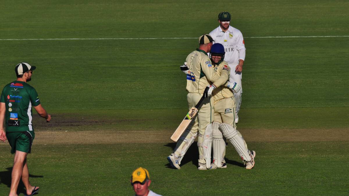 Ed Morrish and Tynan Southcombe after the former's century. Picture by Lachlan Harper 