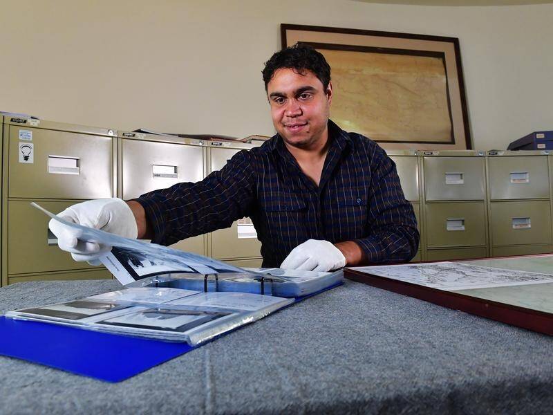 Aboriginal Heritage Officer Winston Green with Strehlow Collection items in Alice Springs. (CHLOE ERLICH/AAP IMAGES)
